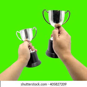 hand hold reward silver cup on green screen Background - Powered by Shutterstock