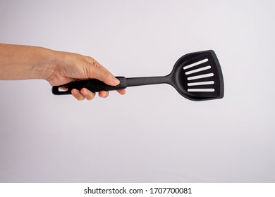 Hand Hold Of Spatula. Isolated On A White Background. Close-up