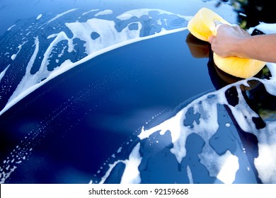 Hand Hold Sponge Over The Car For Washing