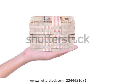 Hand hold stack of one million thai baht banknote money isolated on white background.