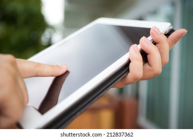 Hand hold white tablet - Shutterstock ID 212837362
