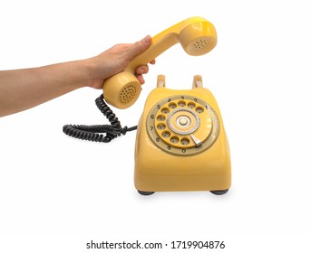 A Hand Hold Yellow Old Classic Style Telephone