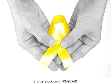 Hand Hold Yellow Ribbon A Symbol Of Bone Cancer