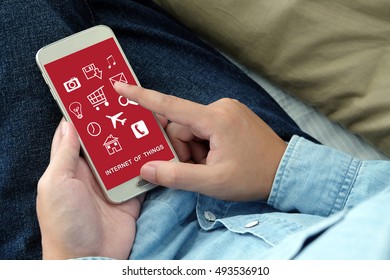 Hand holdding smart phone with Free wifi area sign on  screen background, connectivity concept, digital technology - Shutterstock ID 493536910