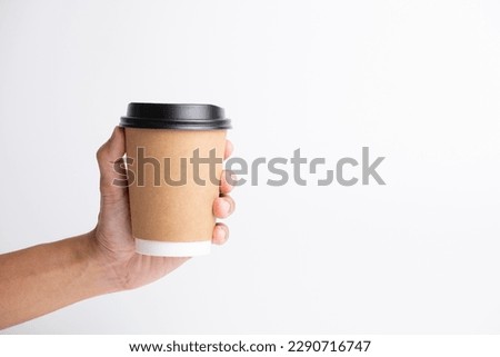 Hand holder hot drink craft paper cup in isolated white background