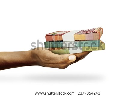 Hand Holding 3D rendering of stacks of Ghanaian cedi notes isolated on white background