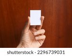 Hand holding A9 paper mockup. Portrait A9 international paper size mockup. Simple, clean, modern, minimal paper mock up. Paper mockup in hand