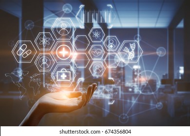 Hand holding abstract glowing medical icons on blurry interior background. Futuristic concept.  Double exposure  - Powered by Shutterstock