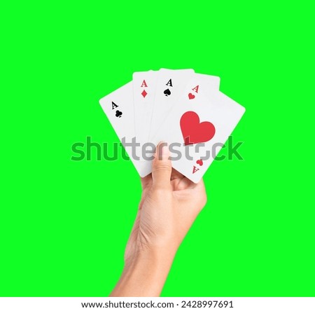 Hand Holding Ace Card, isolated on green screen background. Playing Card game hand poker gambling casino.