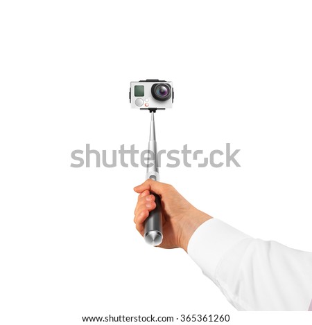 Hand holding action camera isolated, take selfie. Monopod hold in arm. Active cam, making self portrait. Selfi stick holder.