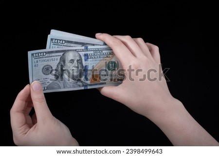 Hand holding American dollar  banknotes isolated on white background