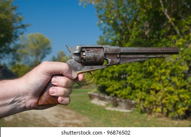 A Hand Holding An Antique Revolver In A Shooting Position.