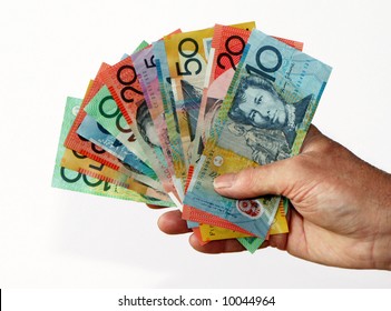 Hand holding Australian currency notes