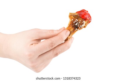 Hand Holding Baked Chicken Wing Isolated On White Background.