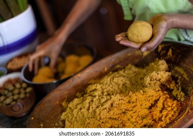 Hand holding ball of corn flour to prepare hallaca or tamale. Traditional food concept