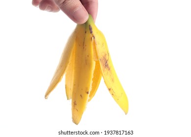 Hand Holding Banana Peel Isolated In White Background Selective Focus