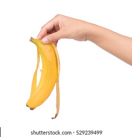 Hand Holding Banana Peel Isolated On White Background