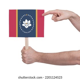 Hand Holding Banner On Wood Stick, Isolated - Flag Of Mississippi