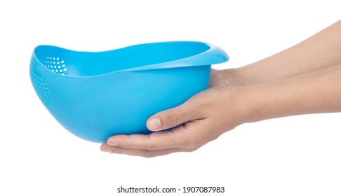 Hand holding basket kitchen supplies water basket wash vegetable bowl isolated on a white background - Shutterstock ID 1907087983