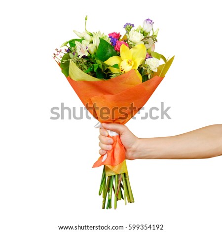 Hand holding a beautiful bouquet of different flowers. Isolated on a white background