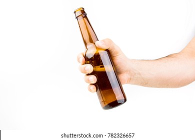 Hand Holding Beer Bottle On White Background Closeup