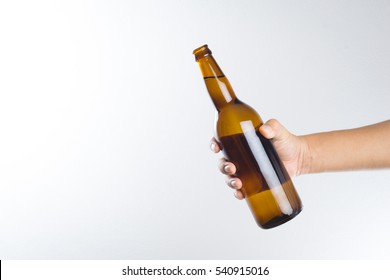 Hand Holding A Beer Bottle Without Label Isolated On White Background