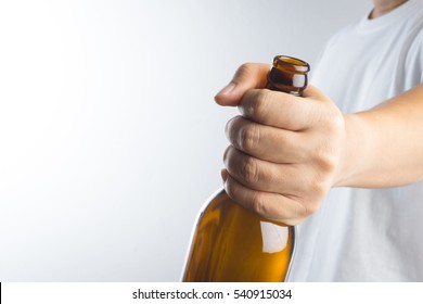 Hand Holding A Beer Bottle Without Label Isolated On White Background