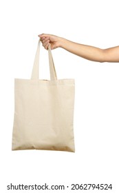 Hand Holding Beige Colour Canvas Tote Bag Isolated On White Background.