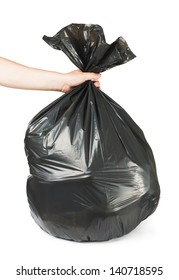 Hand Holding Black Bag Of Rubbish. White Isolated Studio Shot.