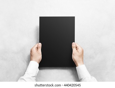 Hand Holding Black Blank Paper Sheet Mockup, Isolated. Arm Hold Clear Grey Brochure Template Mock Up. Leaflet Document Surface Design. Simple Pure Dark Print Display Show. Reading Contract Agreement.