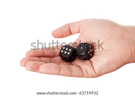 Hand holding black dices showing numbers 