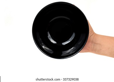 hand holding a blackbowl isolated on white