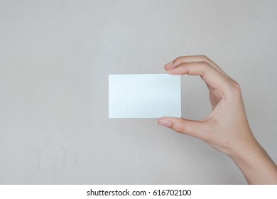 hand holding blank card isolated with clipping path - Shutterstock ID 616702100