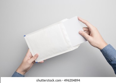 Hand Holding Blank Padded Envelope Mock-up, Ready To Replace Your Design.