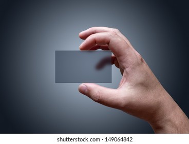 A Hand Holding A Blank Transparent Business Card.