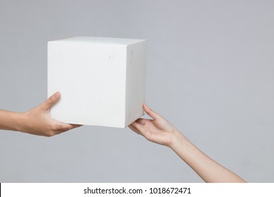 Hand Holding Blank White Box Give Gift On Grey Background