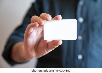 Hand holding blank white credit card mockup front side view. Plastic bank-card design mock up  - Shutterstock ID 640304860