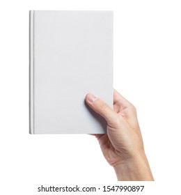 Hand holding a blank white hard cover book, isolated on white background