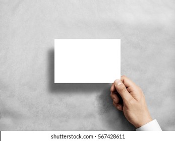 Hand holding blank white postcard flyer mockup. 6 x 4 leaflet mock up presentation. Postal holder. Man show clear post card paper. Sheet template. Invitation booklet reading first person view - Shutterstock ID 567428611