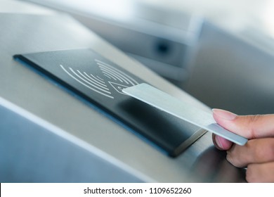 Hand Holding Blue Card To Access Electronic Entrance Scanner, Security Technology