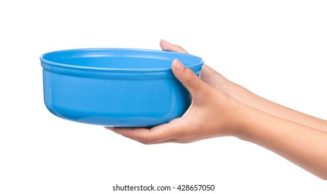 hand holding blue water bowl isolated on a white background - Shutterstock ID 428657050