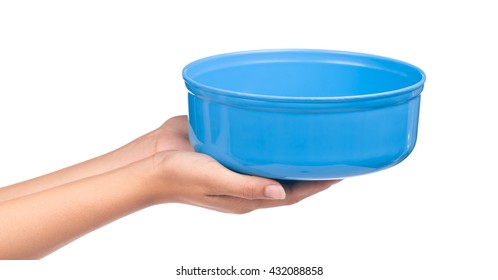 hand holding blue water bowl isolated on a white background - Shutterstock ID 432088858
