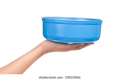 hand holding blue water bowl isolated on a white background - Shutterstock ID 539219041