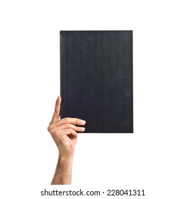 Hand Holding Book Over White Background