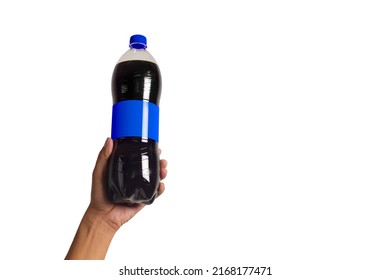 Hand holding a bottle of carbonated soft drinks isolated on white background. There is space for the text on the right.