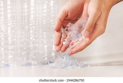 Hand Holding Bottle Flake Or Plastic PET Bottle Flake In White Background,Plastic Bottle,