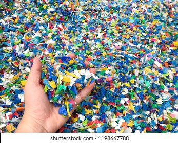 Hand Holding Bottle Flake,PET Bottle Flake,Plastic Bottle Crushed,Small Pieces Of Cut Colorful Plastic Bottles