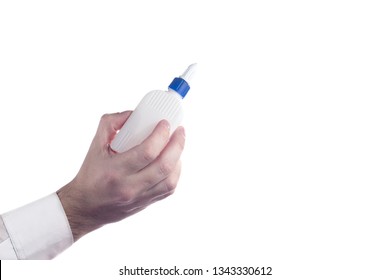 Hand Holding A Bottle Of Glue. PVA Glue. Isolated On White Background With Copy Space