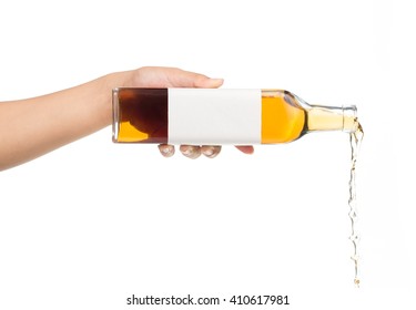 Hand Holding Bottle Pouring Wine Isolated On White Background