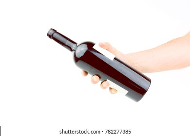 Hand Holding Bottle Of Red Wine On White Background Closeup